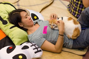 CARA Volunteer Glady Rosales with Guyito, a rescued Puspin 